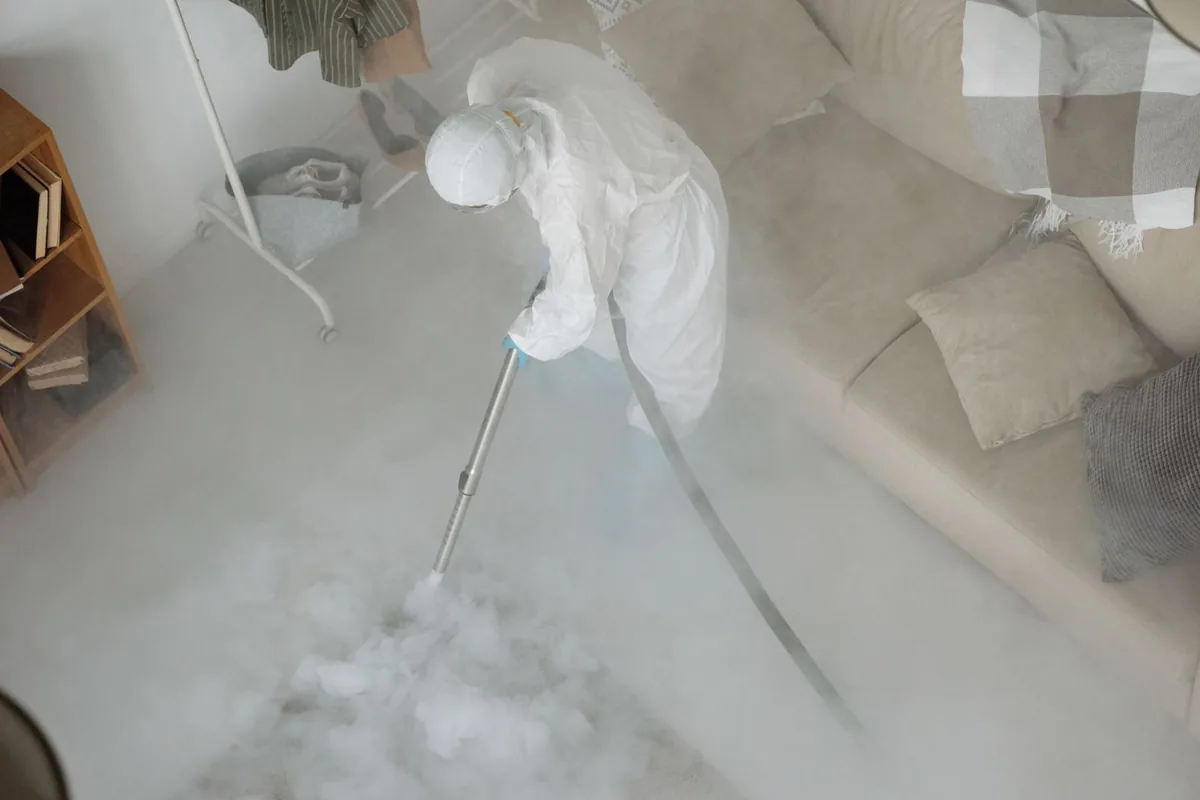 Biohazard cleanup technician in protective equipment, Washington, WV